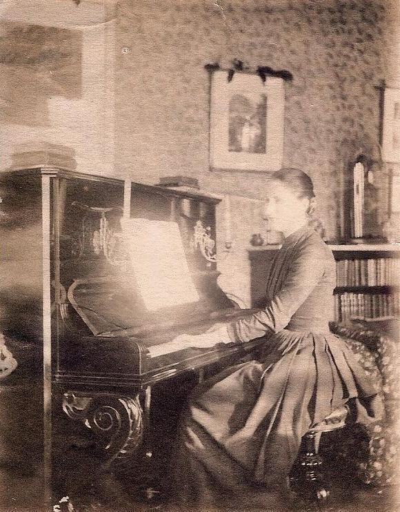 Possibly Edith at the piano